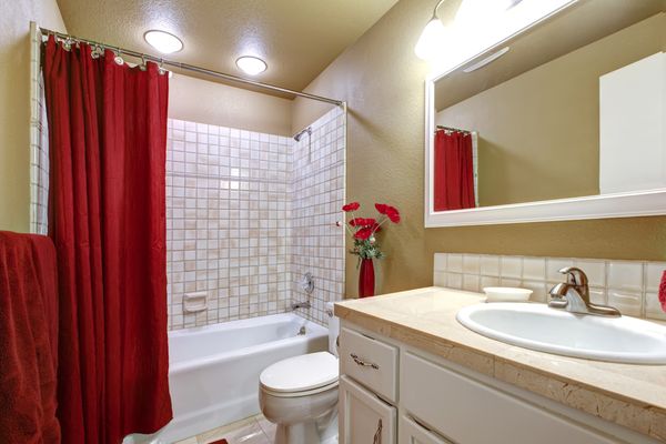 Small bathroom with tile shower and floor