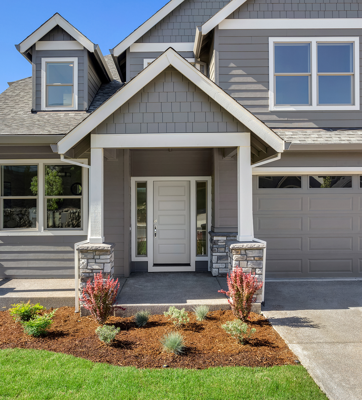 Modern gray house with white trim and front porch The Home Improvement Experts