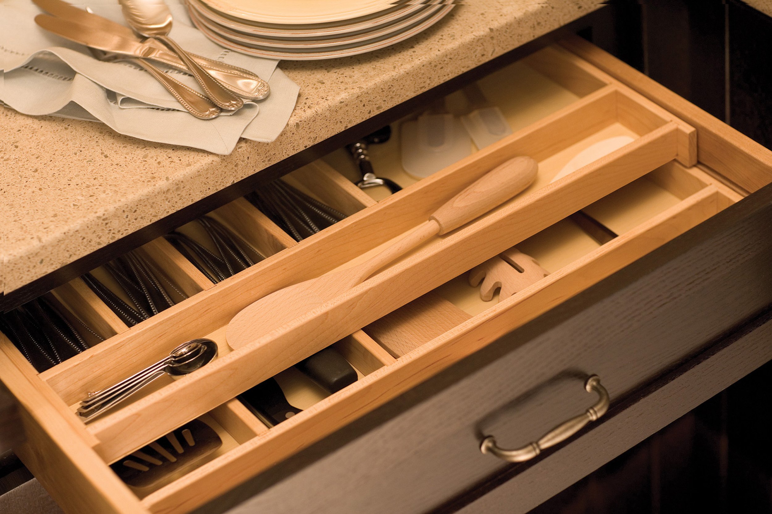 Multi layered kitchen drawer with great storage for silverware and cooking tools