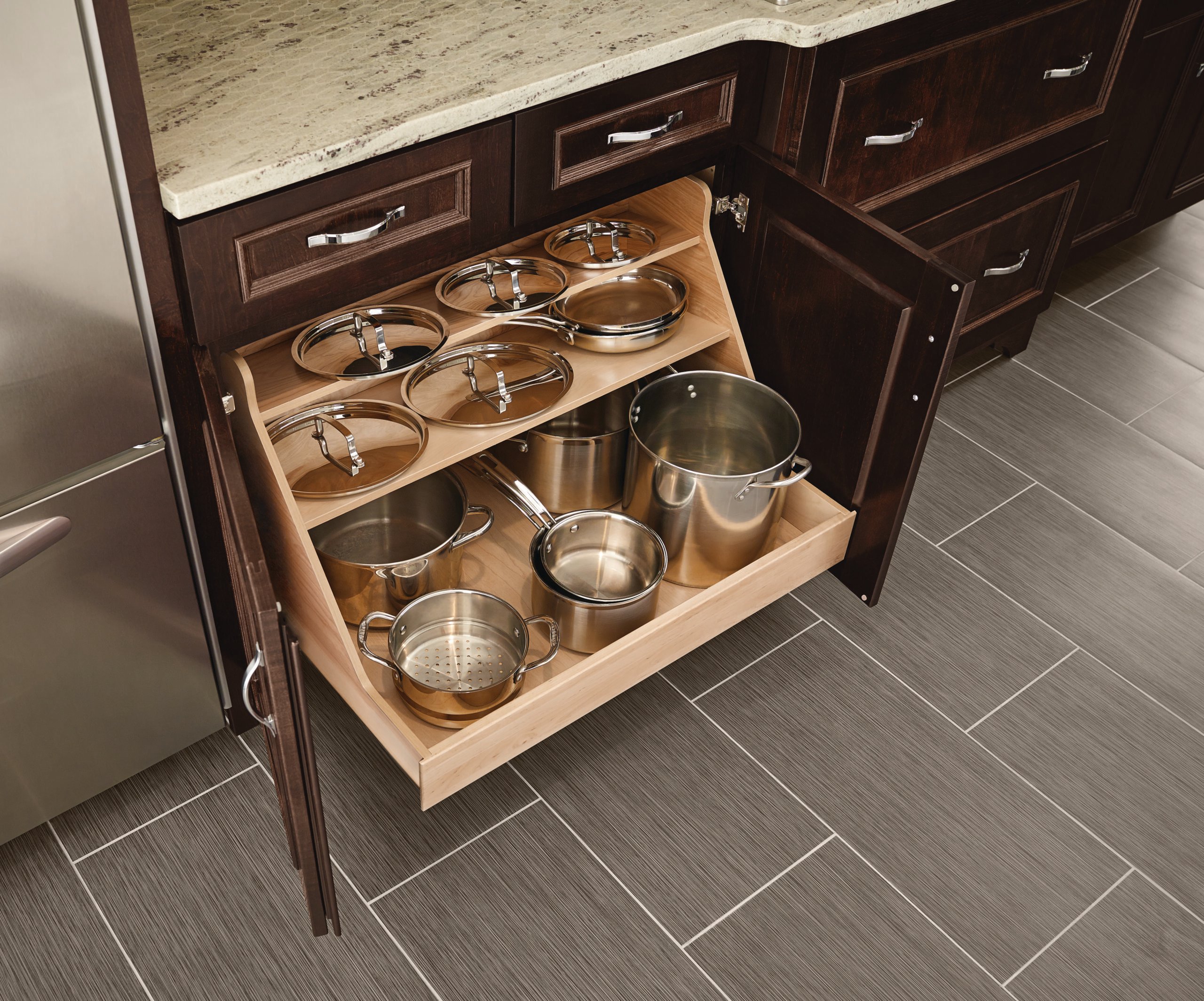 Semi-custom kitchen cabinet with built-in pot and pan storage.